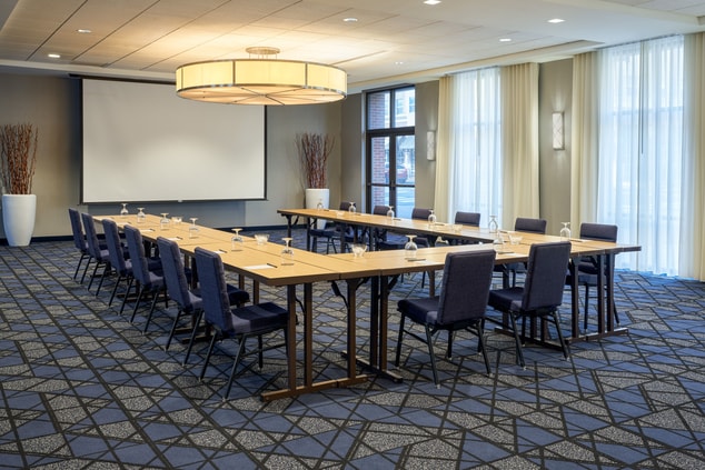 U-shaped table setup in meeting room