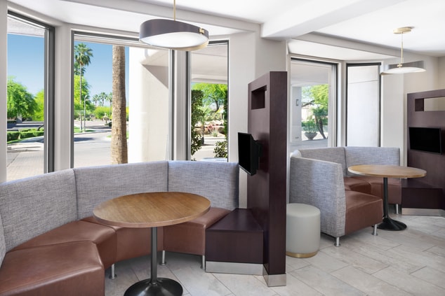 Experience personalized accommodations with our Media Pods, offering a space with private seating and personal televisions to either work or unwind.