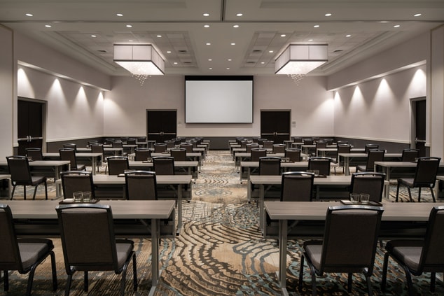 Large ballroom space with tables and chairs.