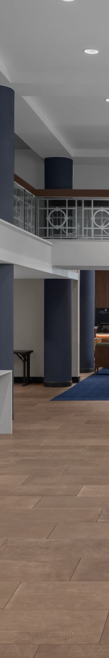 lobby with reception desks and staircase