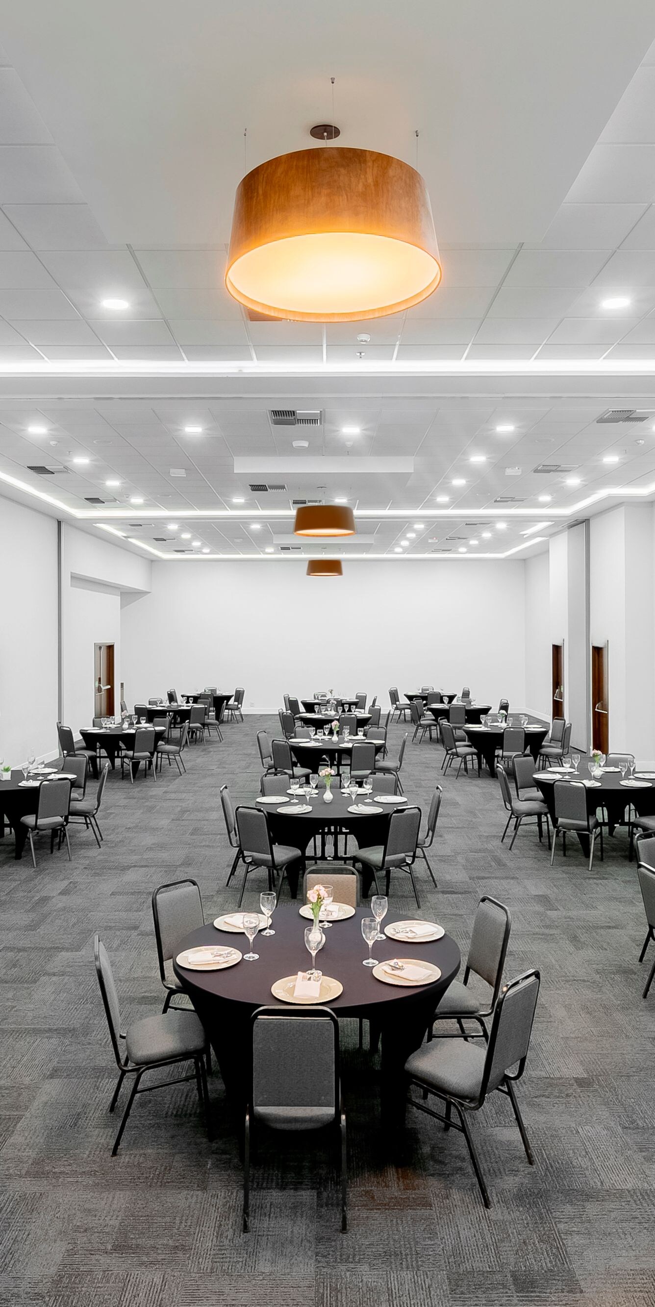 Ballroom with round tables and chairs set