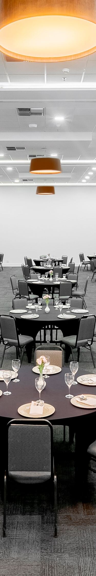 Ballroom with round tables and chairs set