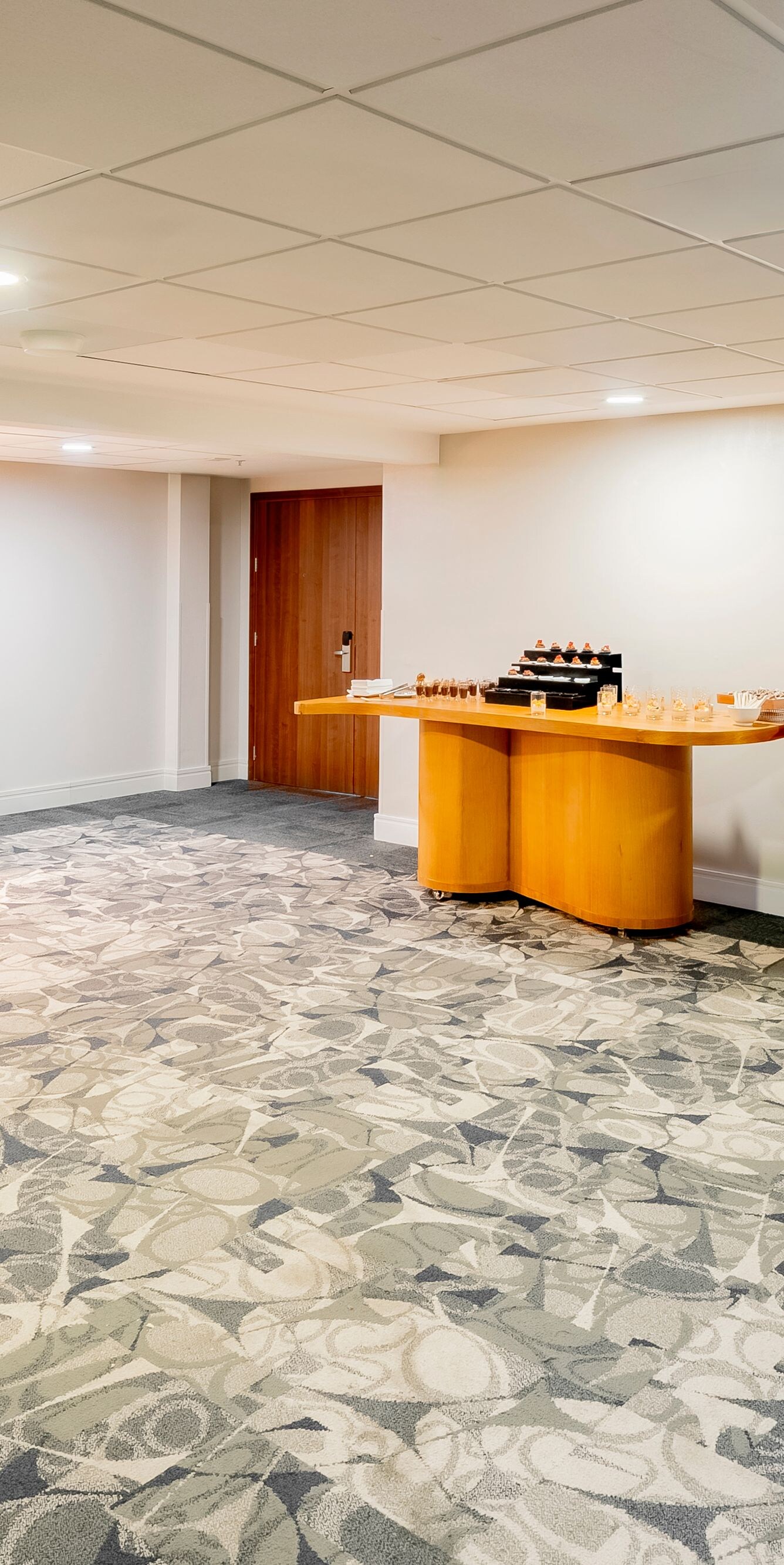 Coffee break setup with tables, seating and snacks