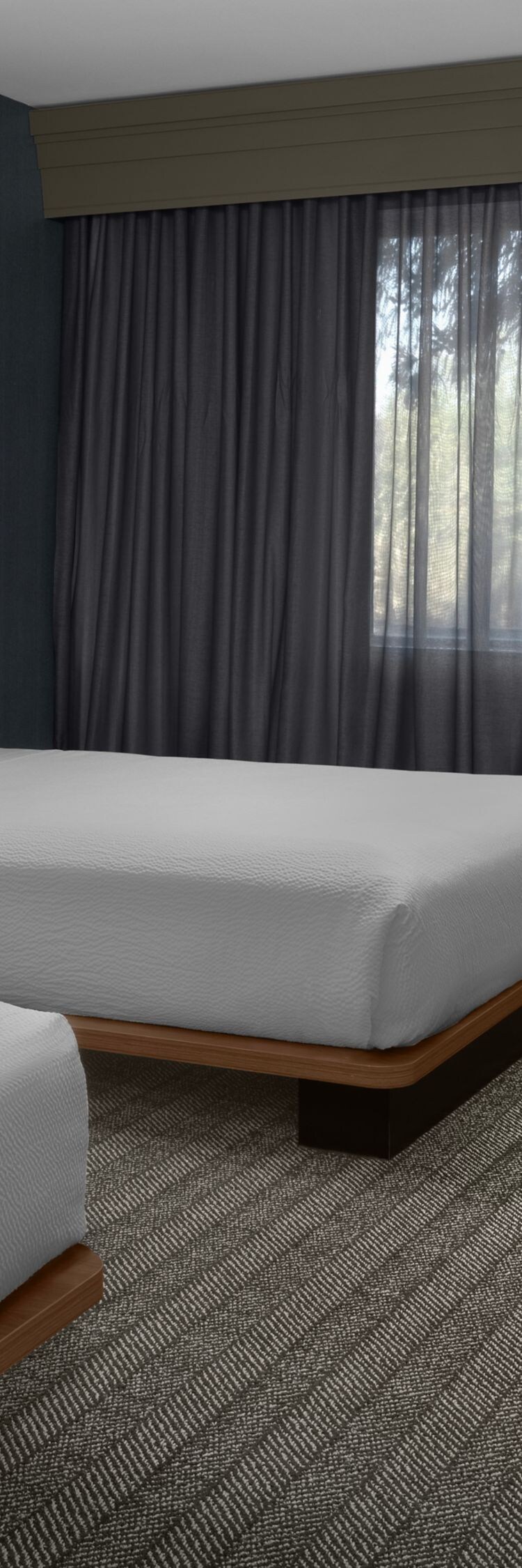 Wide view of accessible room with two queen beds