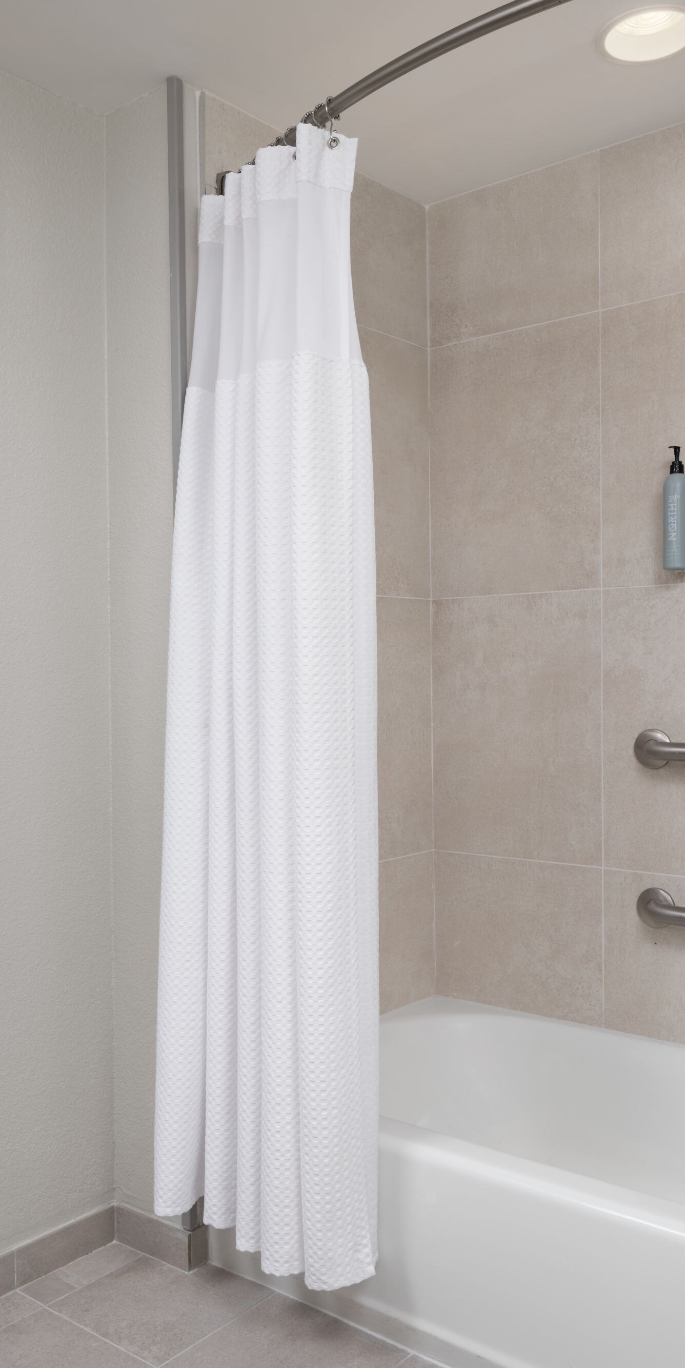 Accessible bathtub with grab bars.