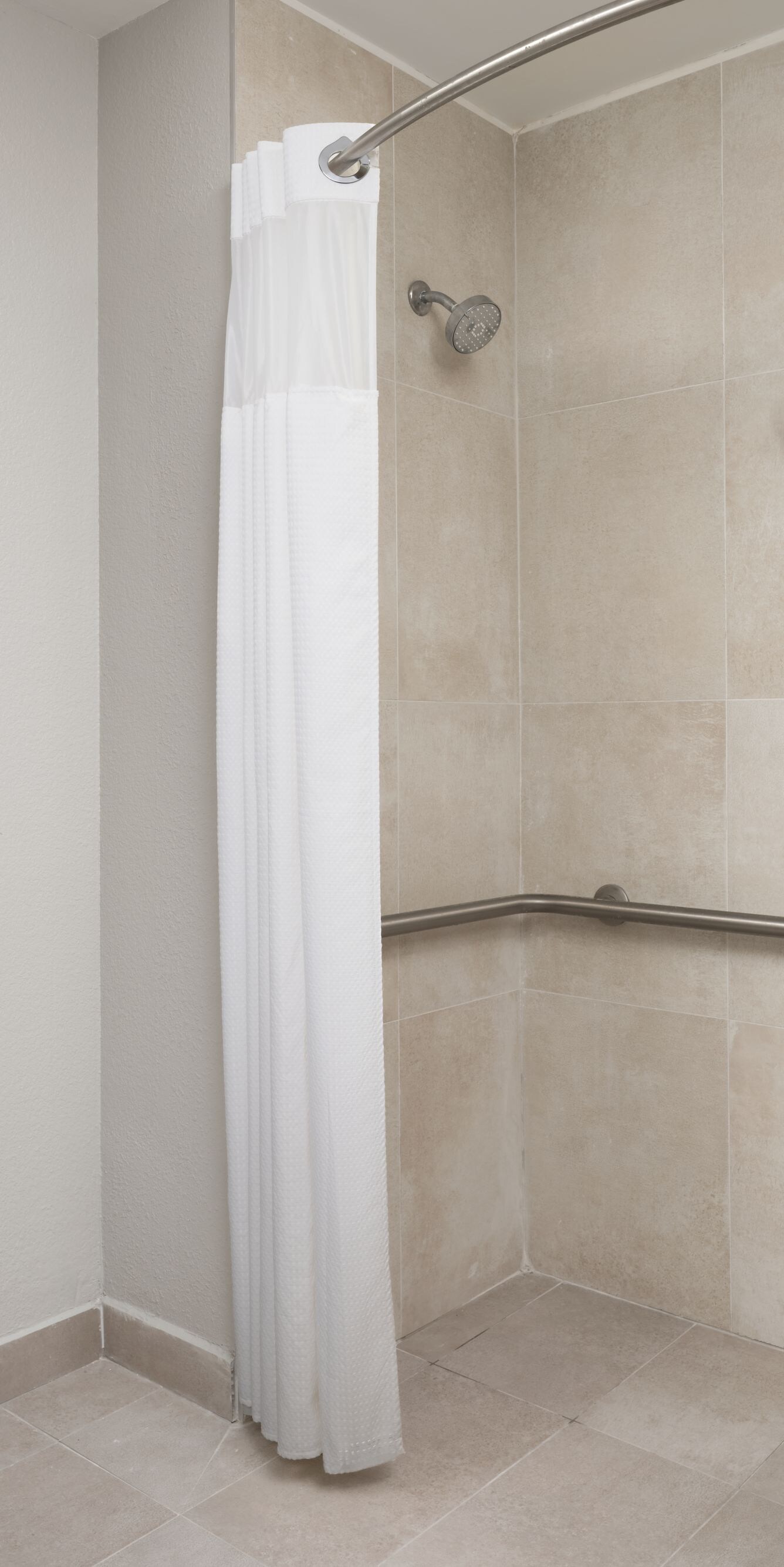 roll-in shower with bench and grab bars