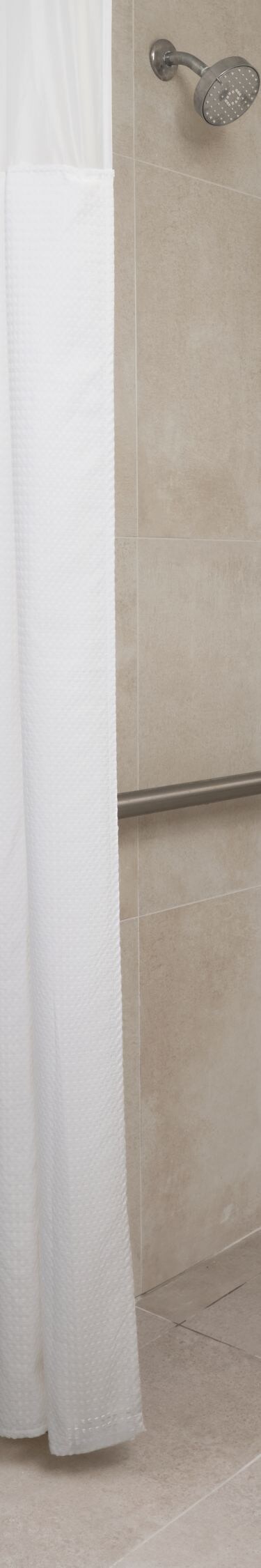 roll-in shower with bench and grab bars