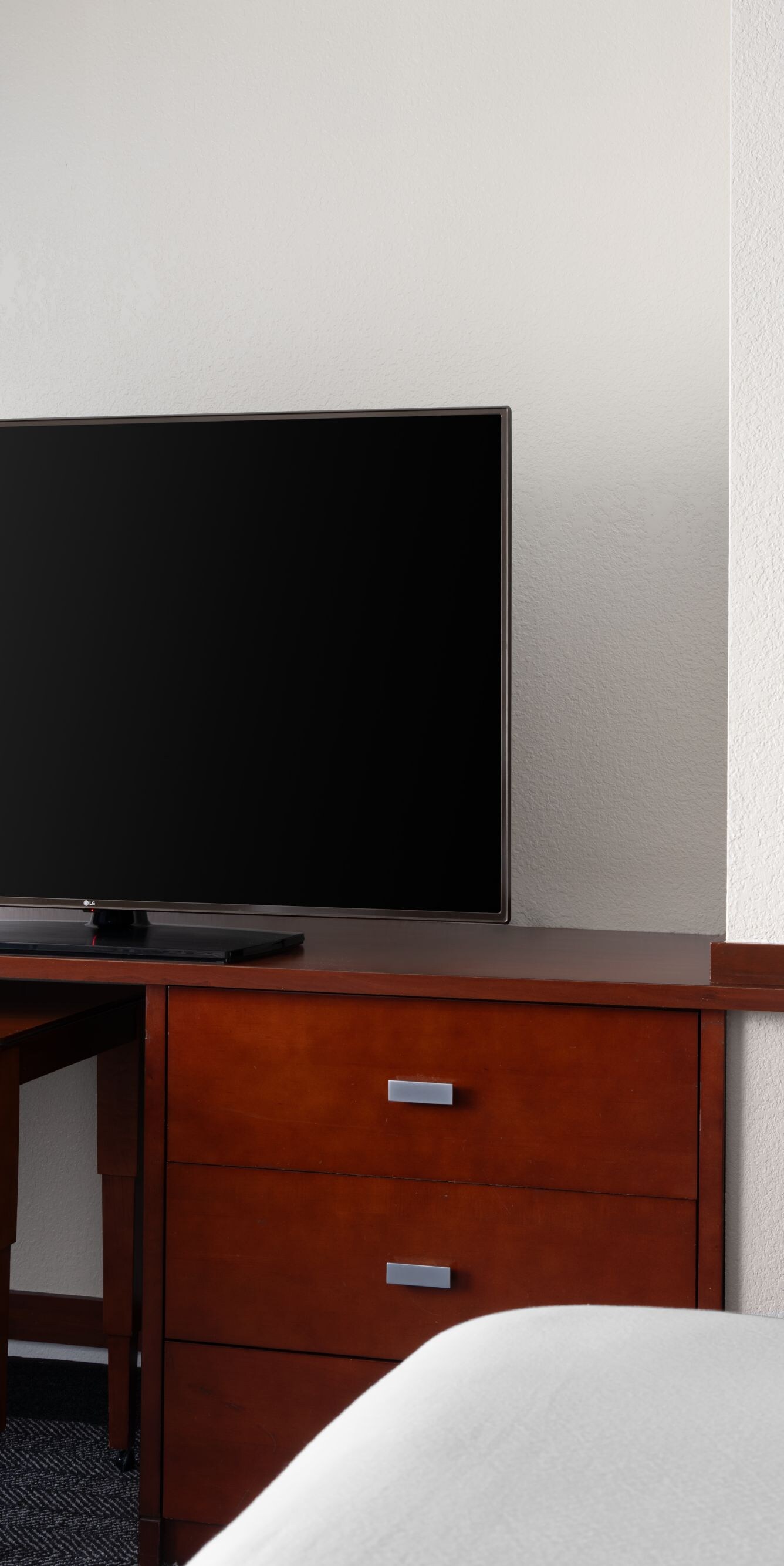work desk with tv and coffee maker