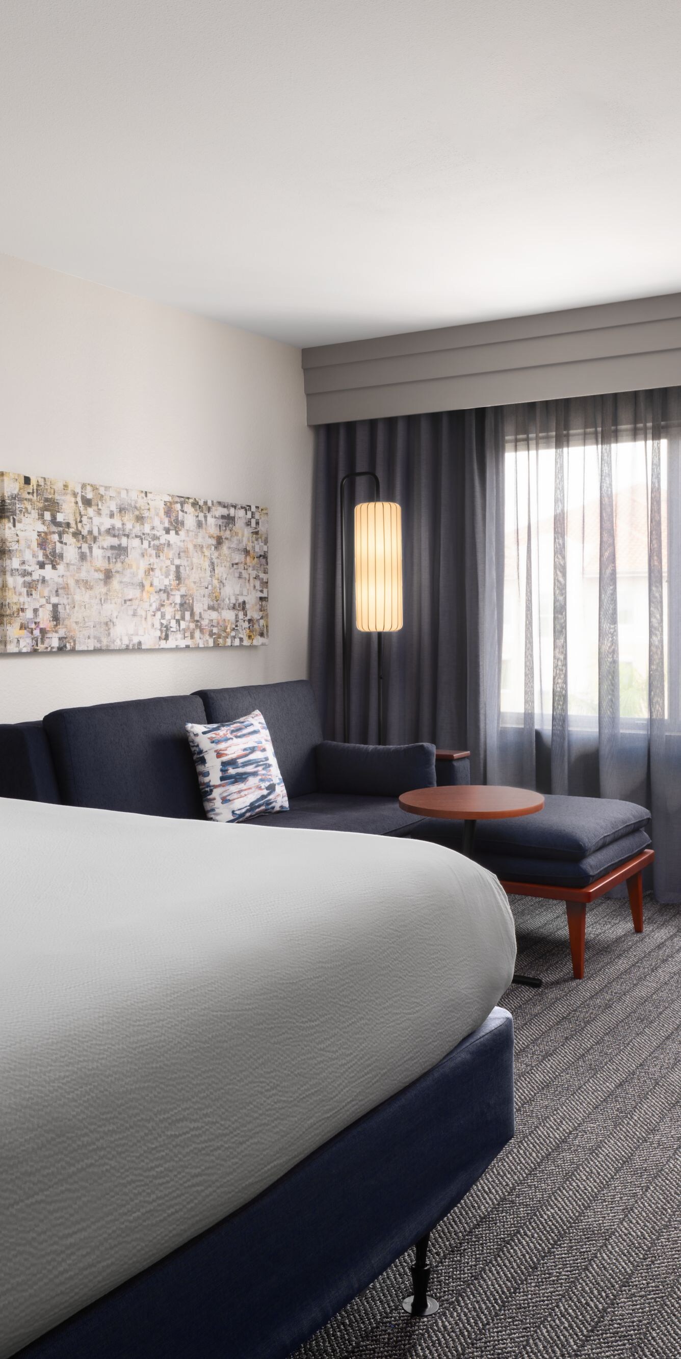 Hotel guest room with bed and seating area