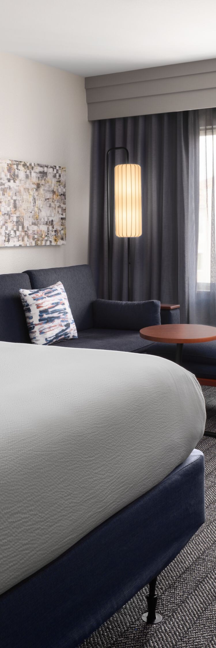 Hotel guest room with bed and seating area