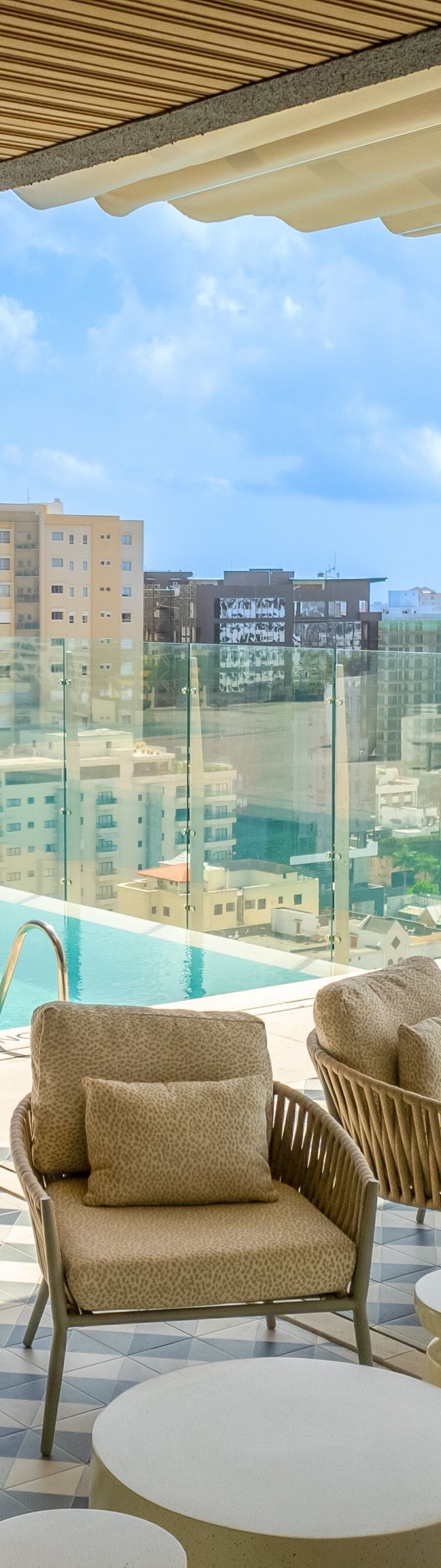 Rooftop lounge pool and city view.