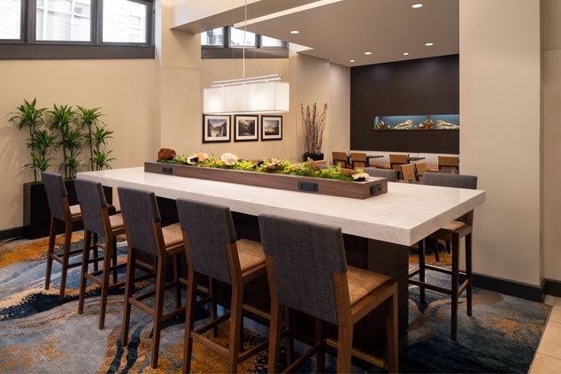Enjoy casual conversation or get down to business at the communal table in our lobby. Complete with task lighting, built-in power outlets and free Wi-Fi, our lobby is sure to meet all your needs.