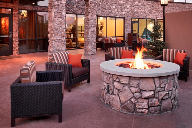 patio with fireplace and seating