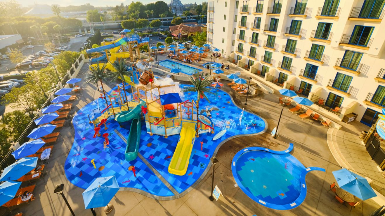 Waterpark featuring slides and splash pad next to 