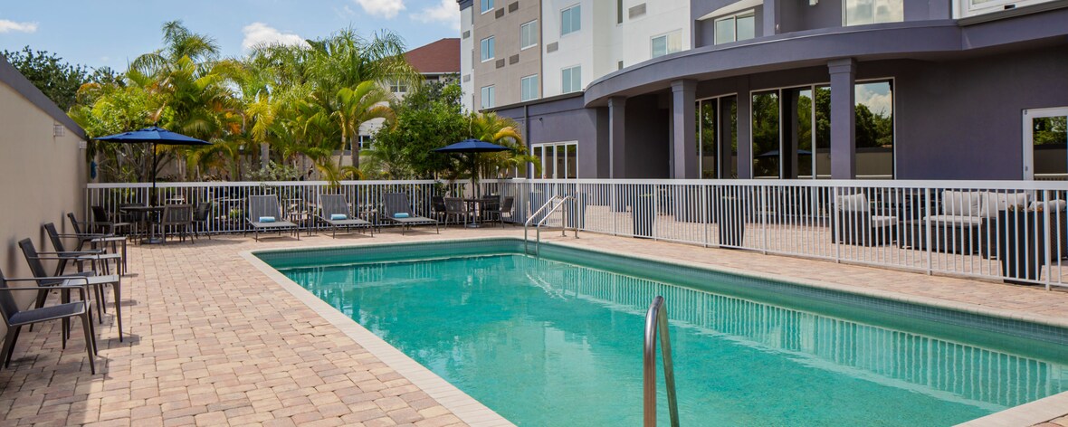 Outdoor pool and pool deck with chairs