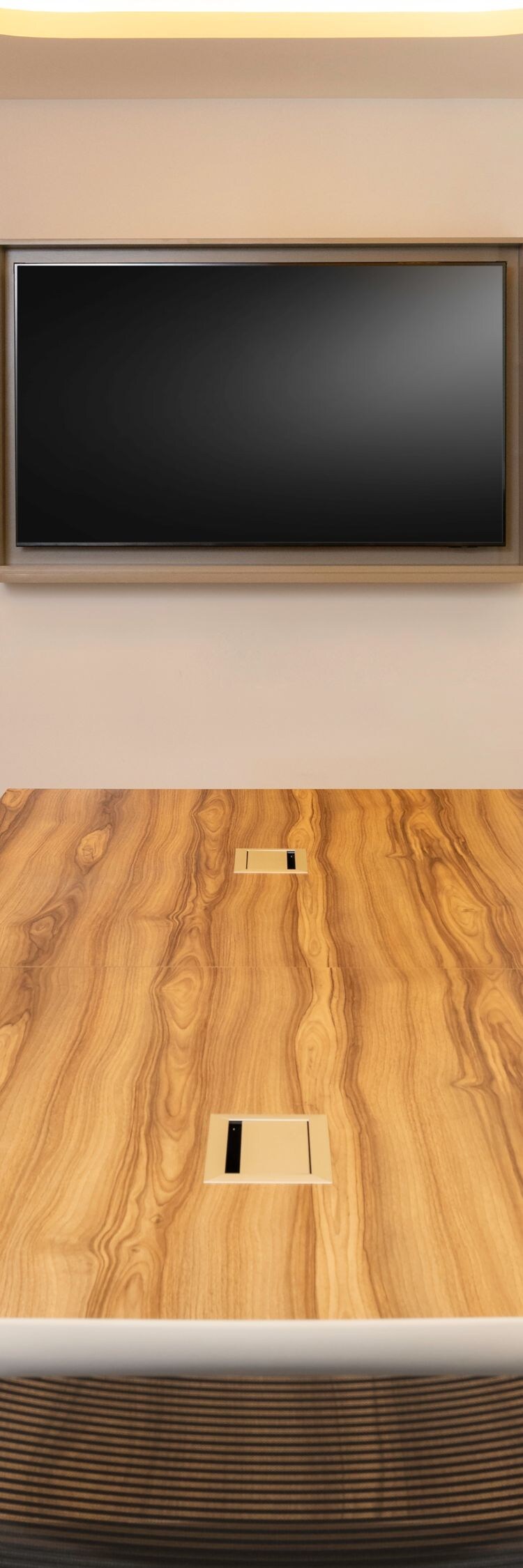 Meeting room with wood table and screen