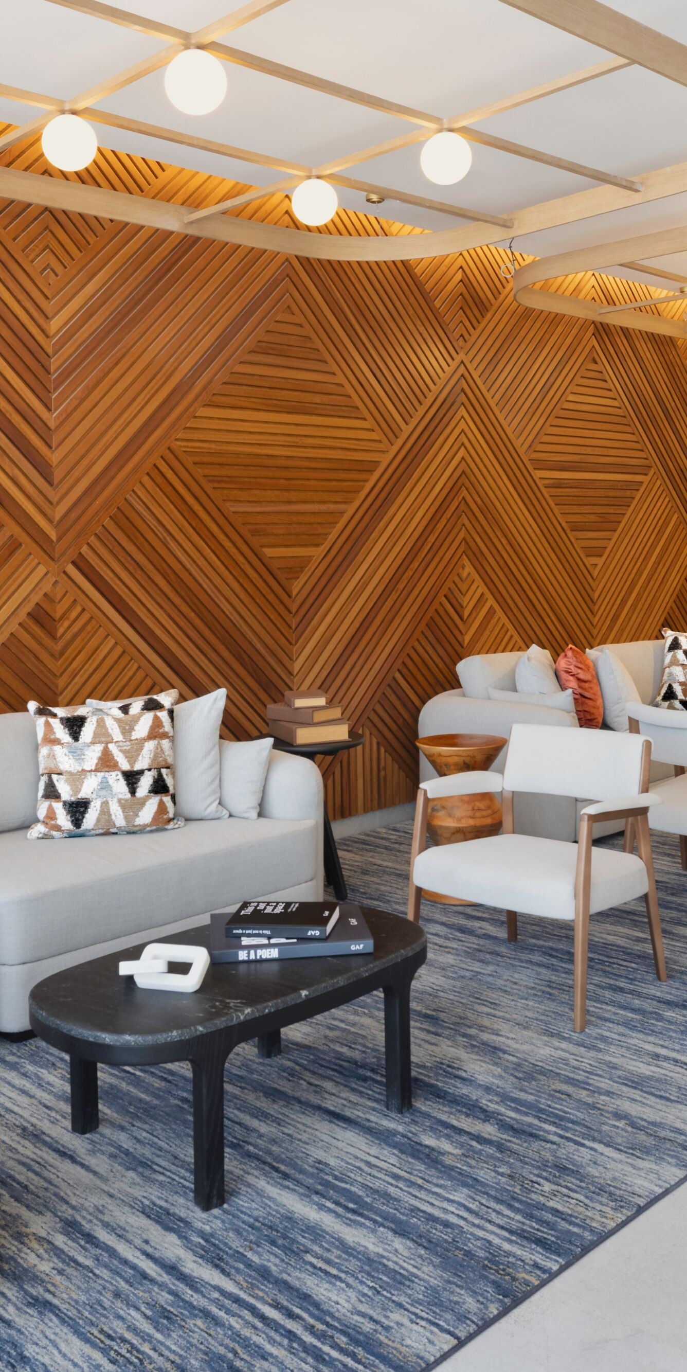 Lobby lounge with wood wall and seating