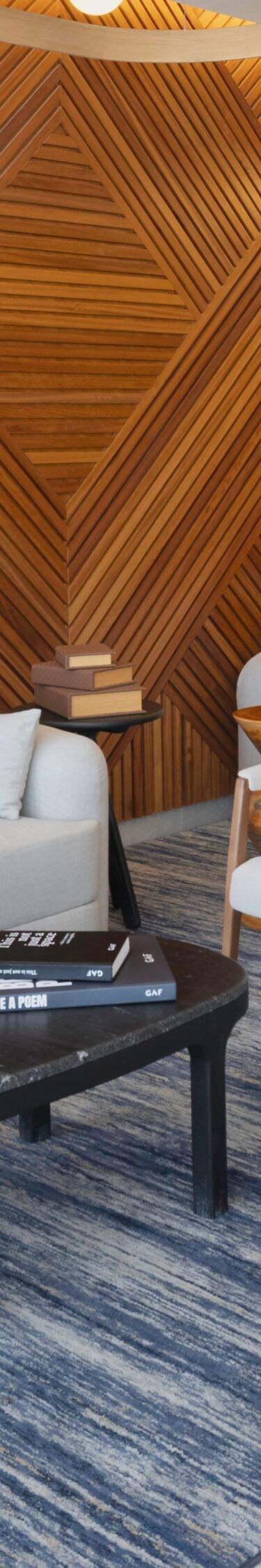 Lobby lounge with wood wall and seating