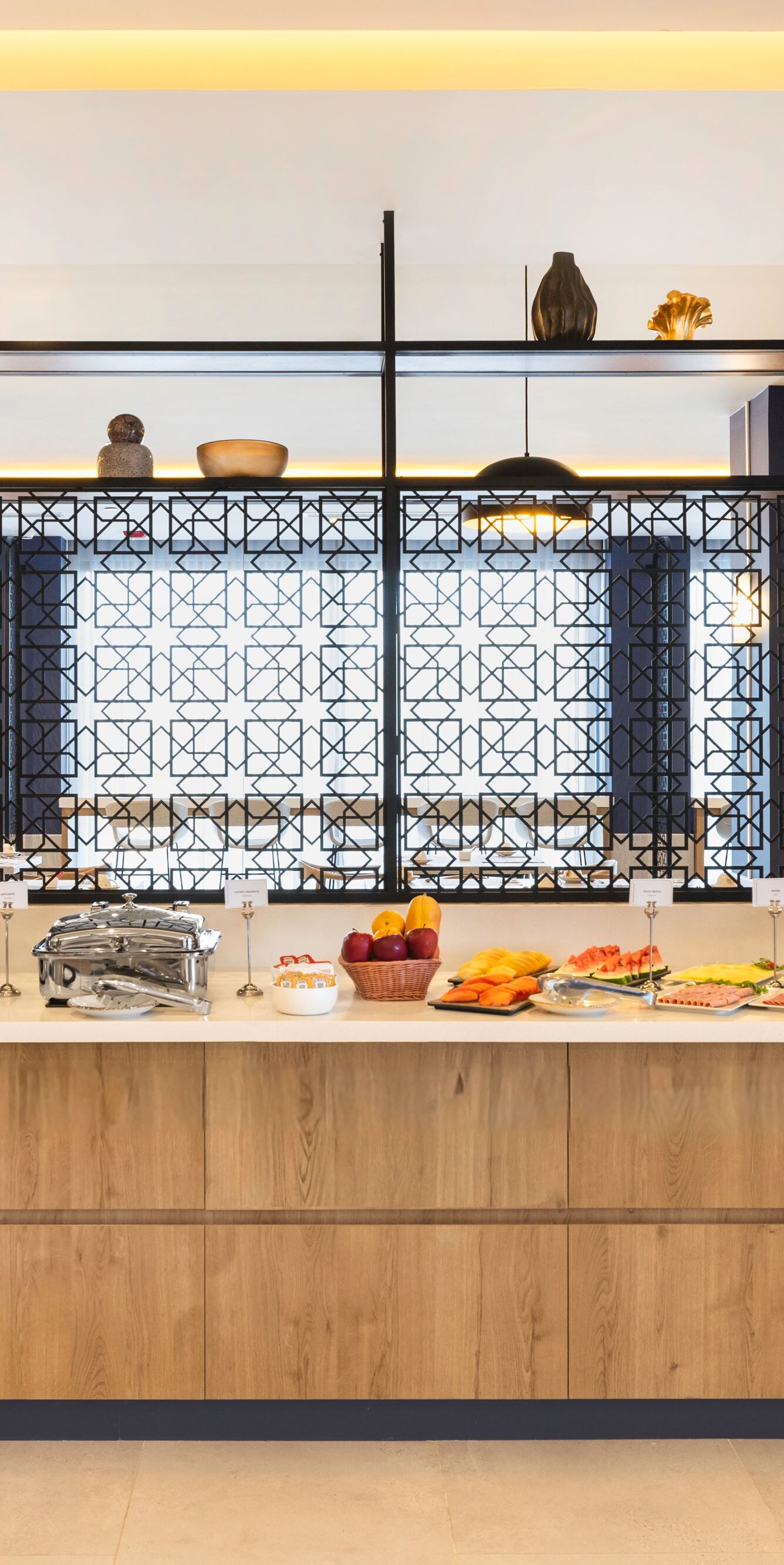 Breakfast buffet with warm dishes and fruit