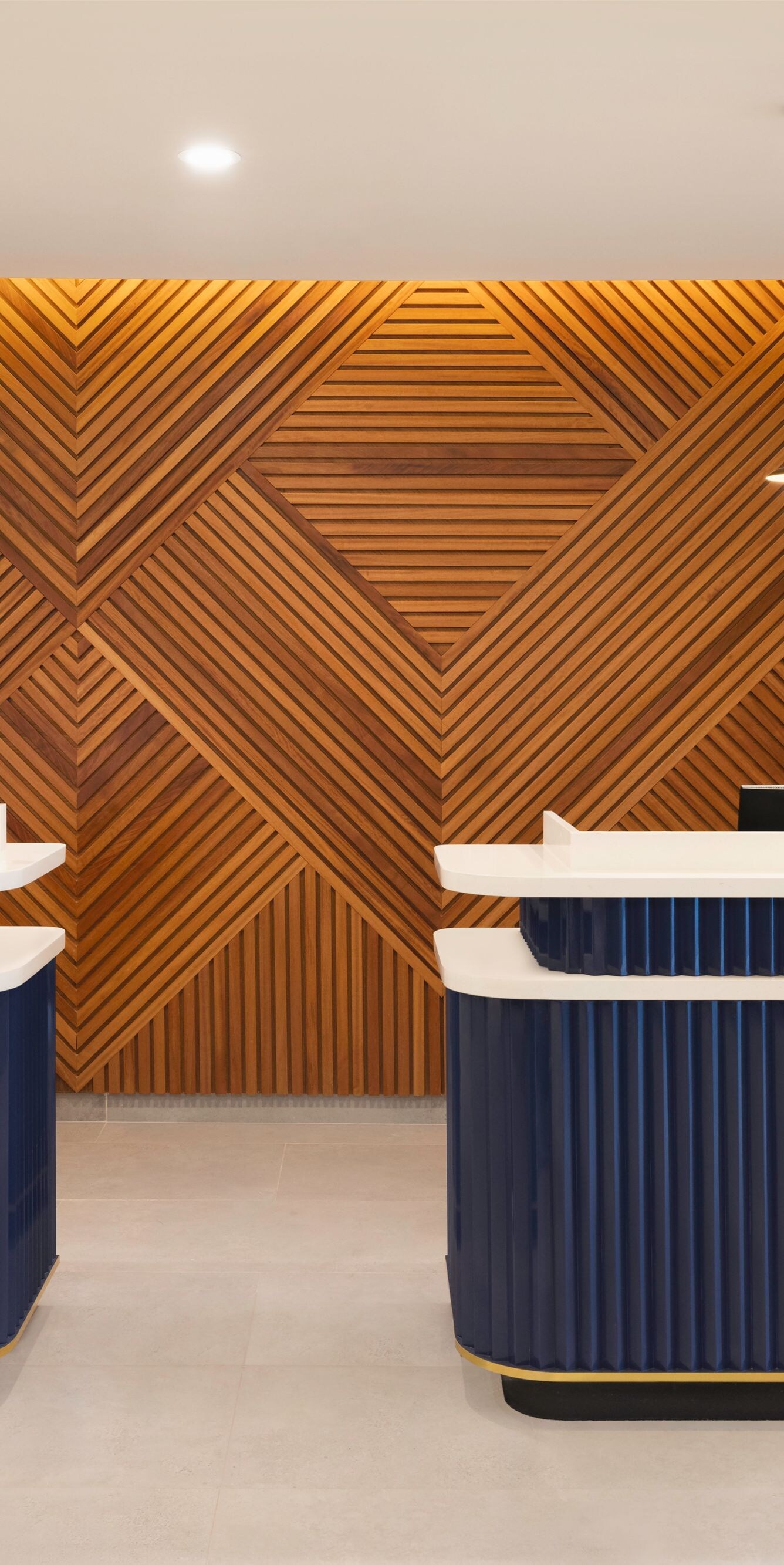 Reception desk with wood wall and lighting