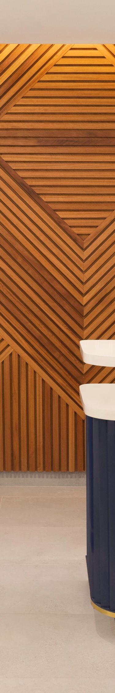 Reception desk with wood wall and lighting