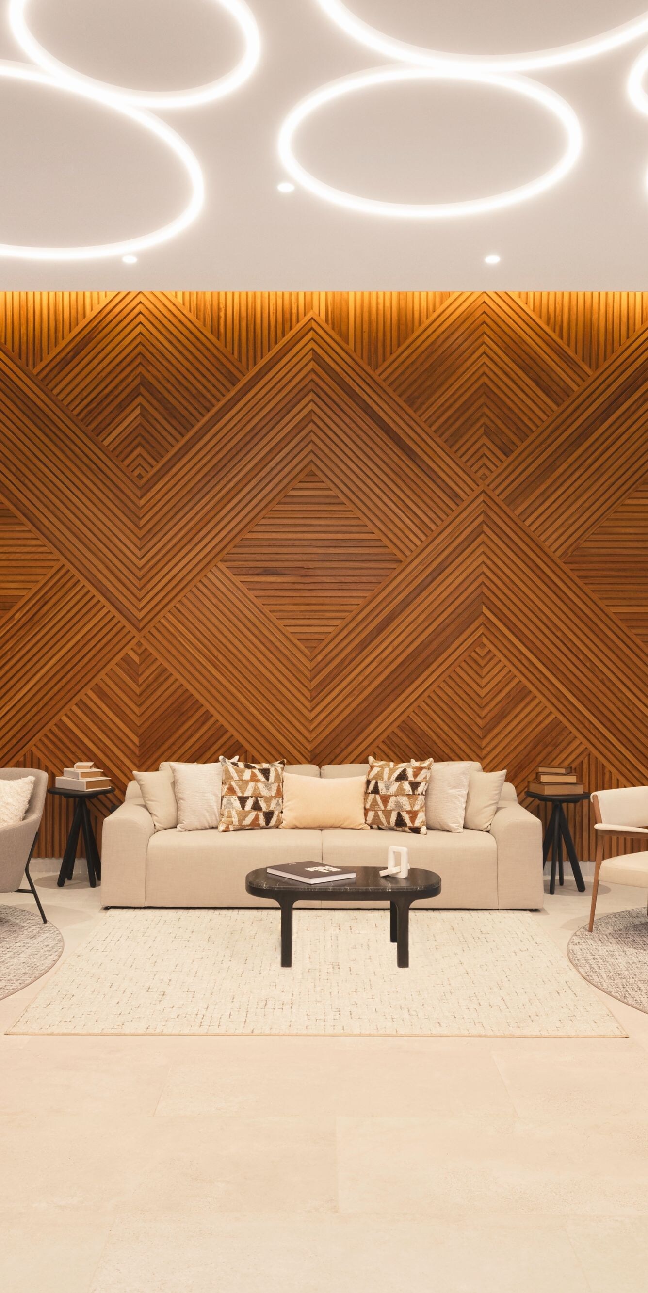 Lobby lounge with wood wall and ring lights