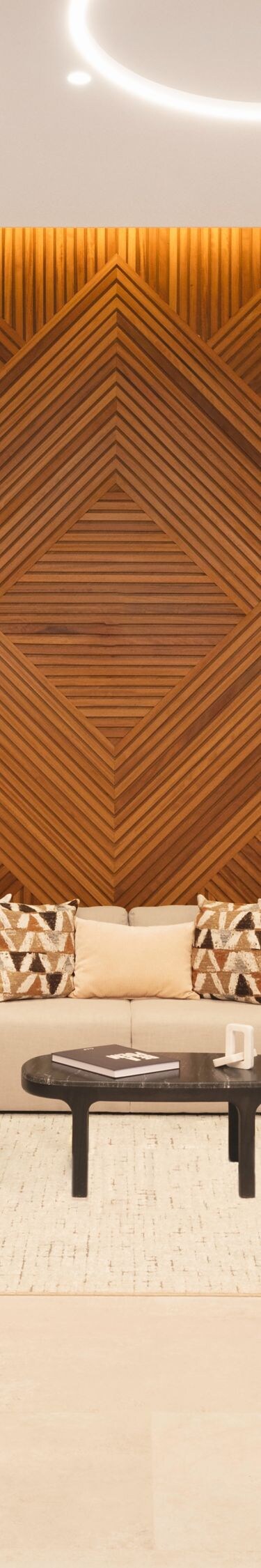 Lobby lounge with wood wall and ring lights