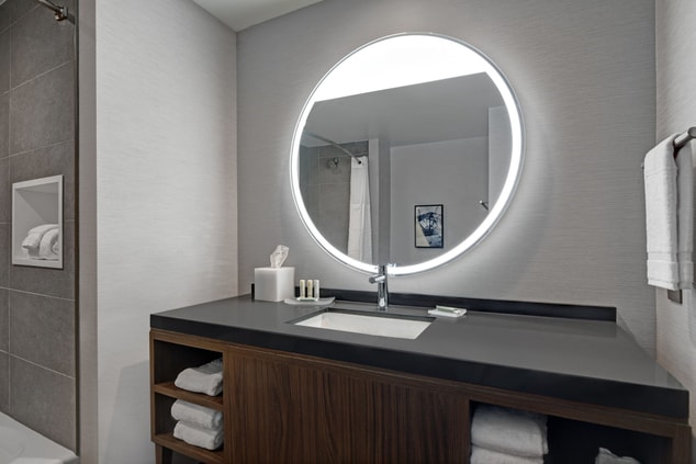 Each bathroom features a light up vanity.