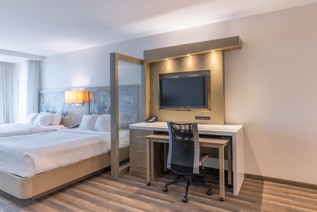 Two Queen Bed Suite with desk space and television