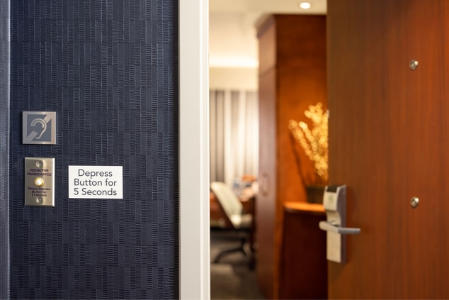 button on door for hearing accessible rooms