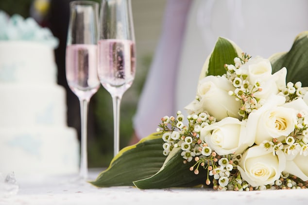 Wedding flowers and two champagne flutes