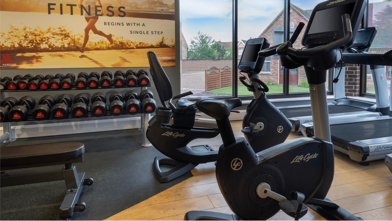 Gym with free weights and other exercise machines.