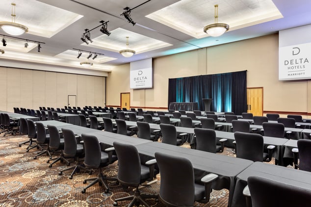 large meeting room with tables and chairs