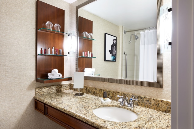 Guest bathroom with granite counters and large mir