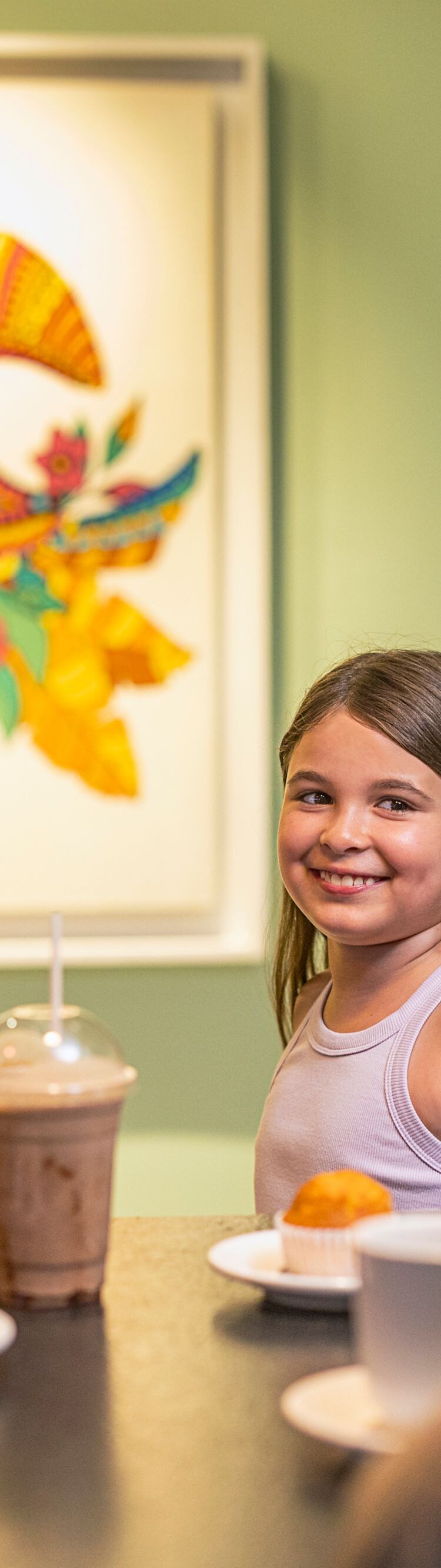 People enjoying drinks and dessert at café