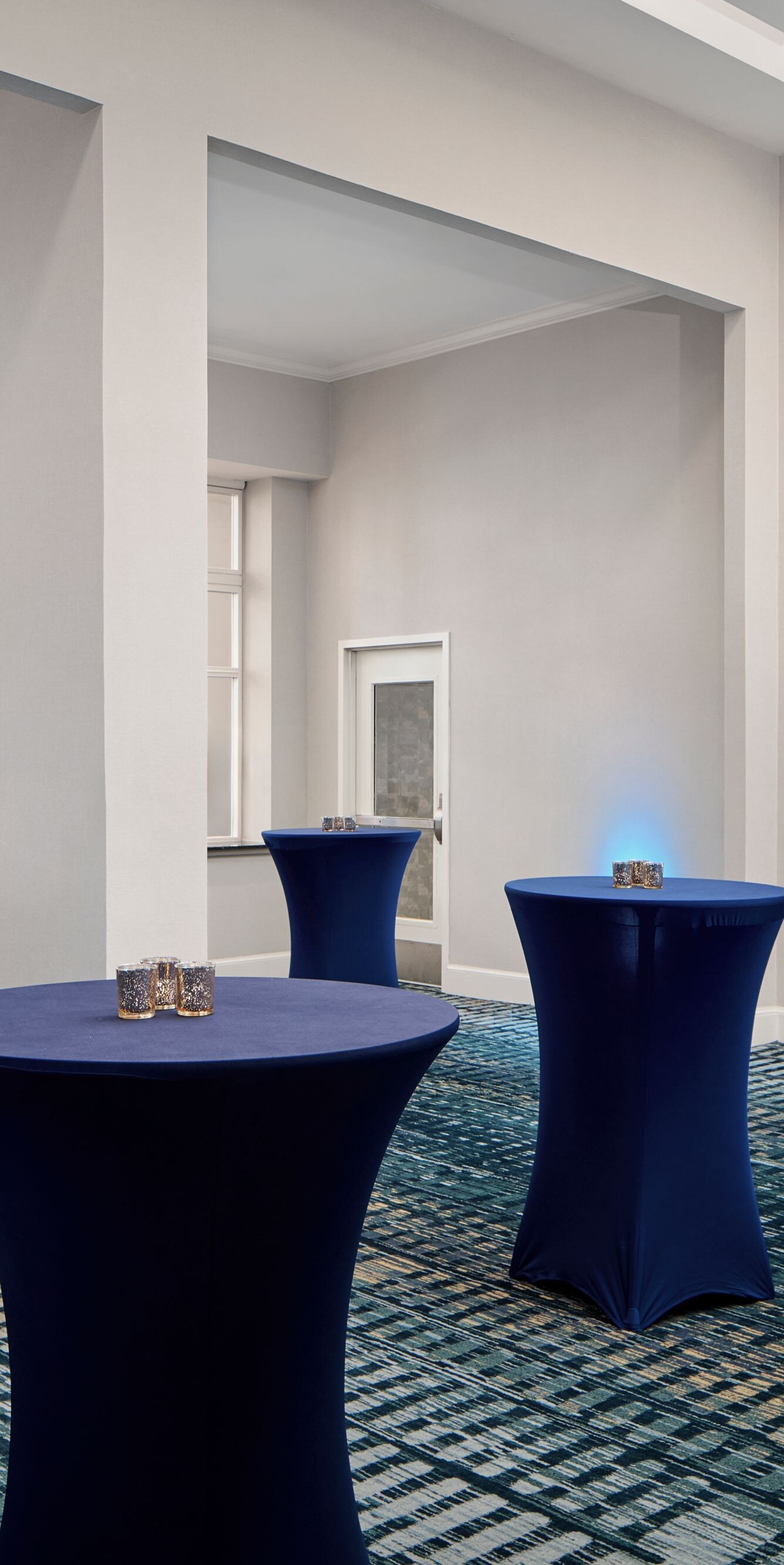 Room with tall cocktail tables