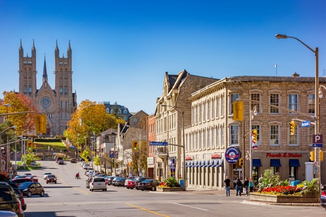 picture with cars, buildings, and basilica, guelph