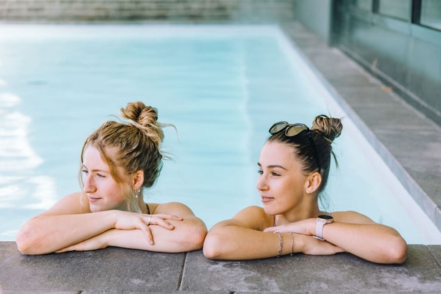 Women relaxing in a pool