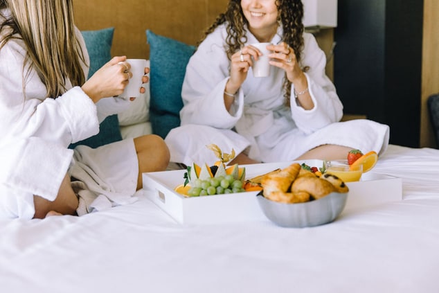 women enjoying Room Service in bed