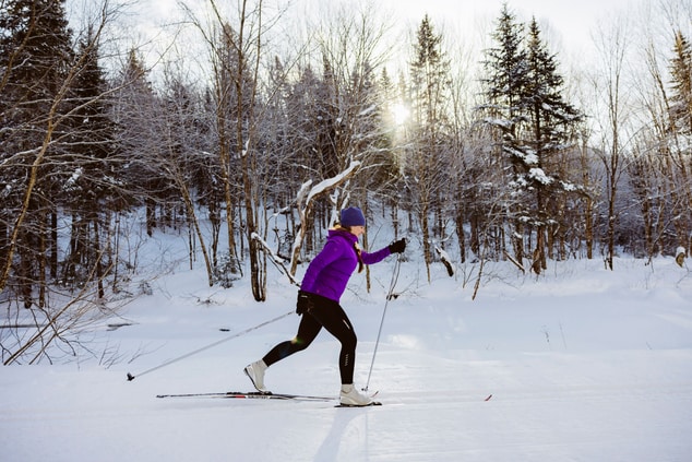 Cross-country skiing in the beautiful forest nearby