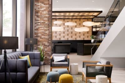 Modern hotel lobby with seating and reception