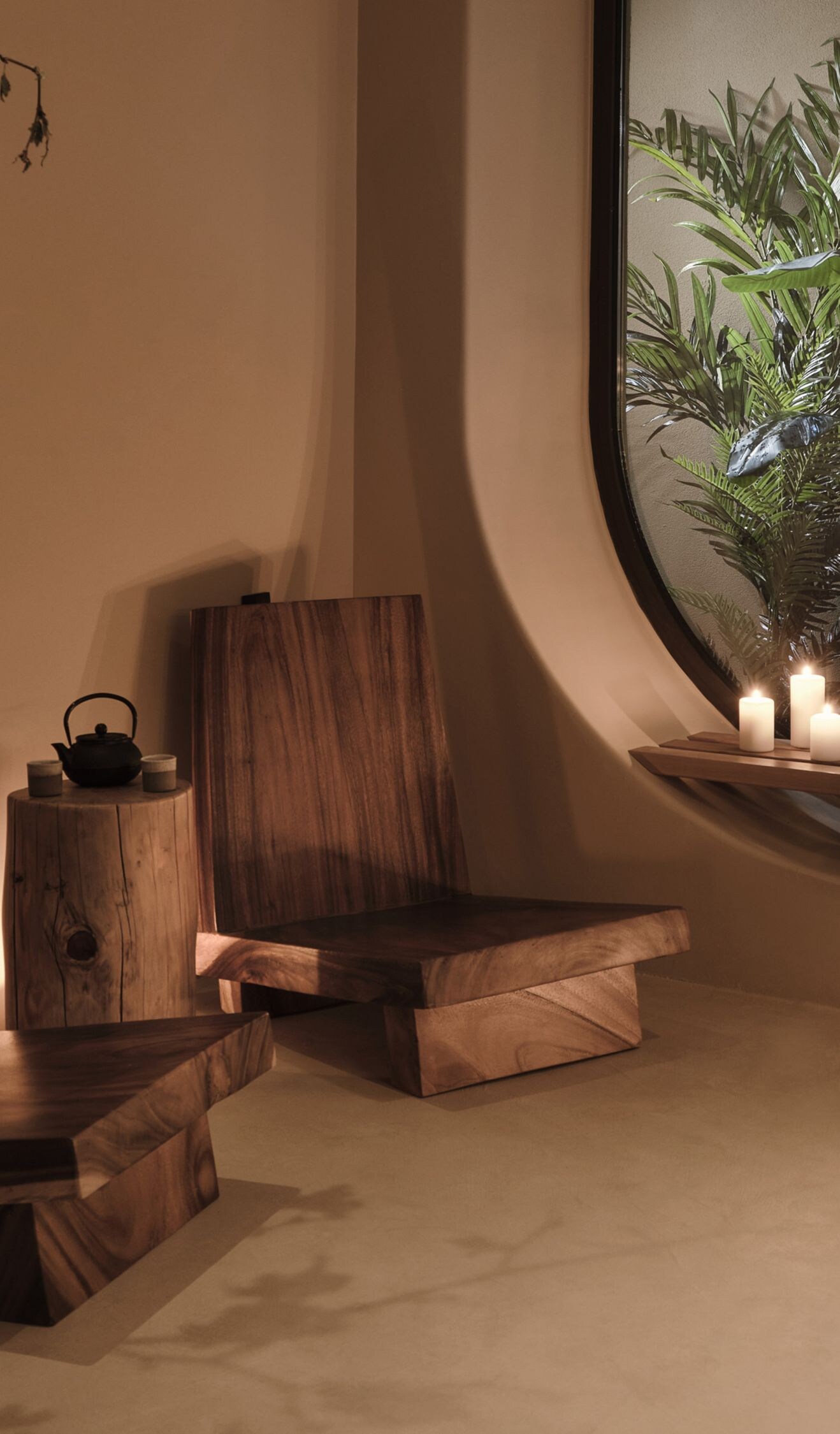 Indoor spa seating with plants and candles