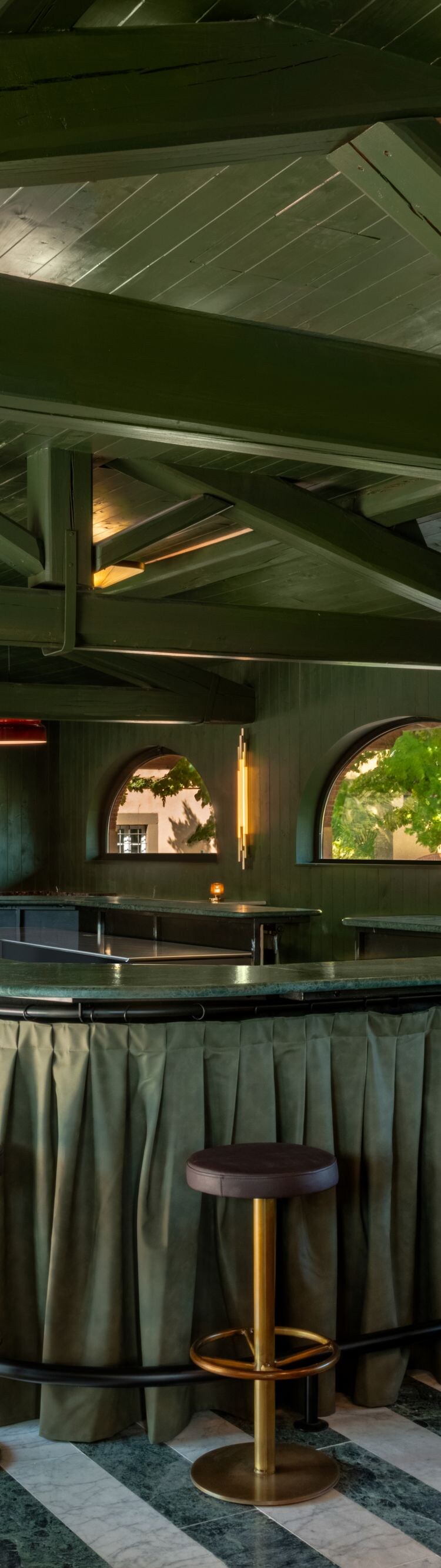 Modern bar with green wood and gold accents