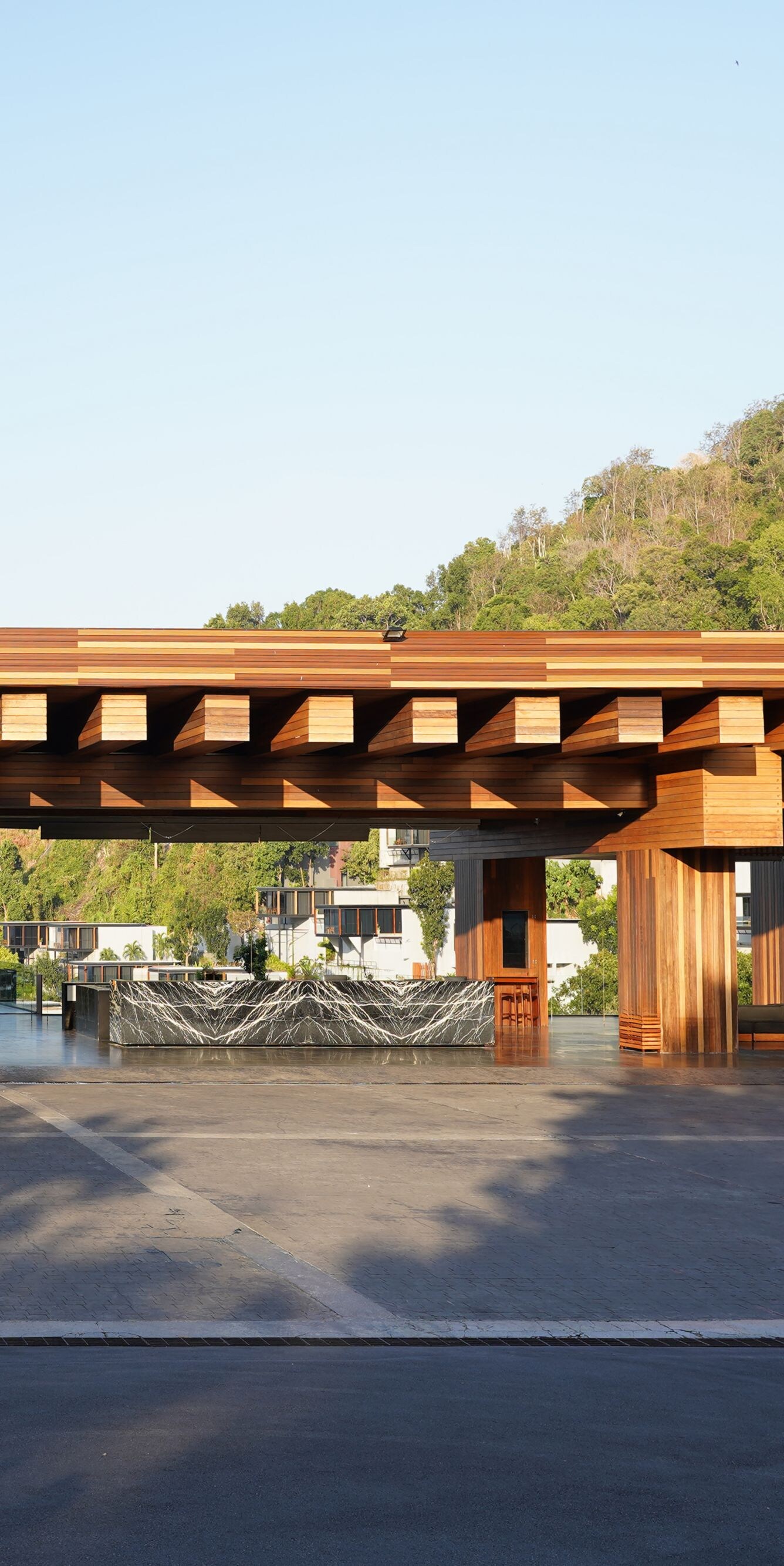 Wooden pavilion with hills in background