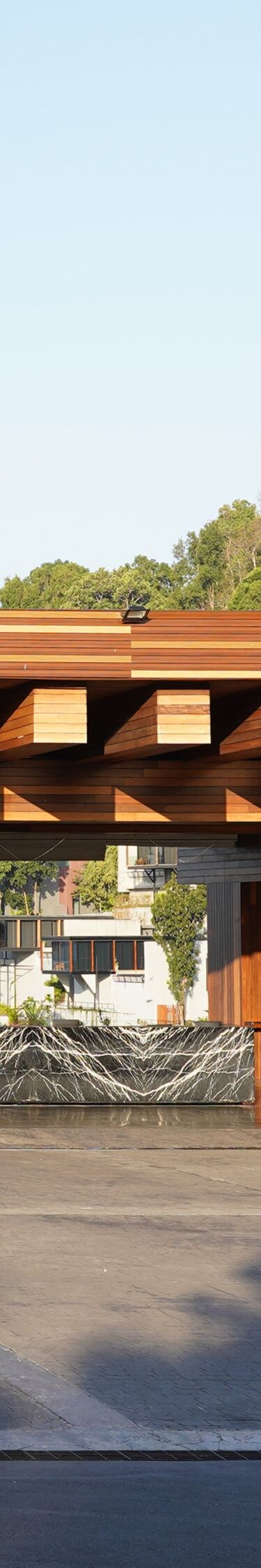 Wooden pavilion with hills in background