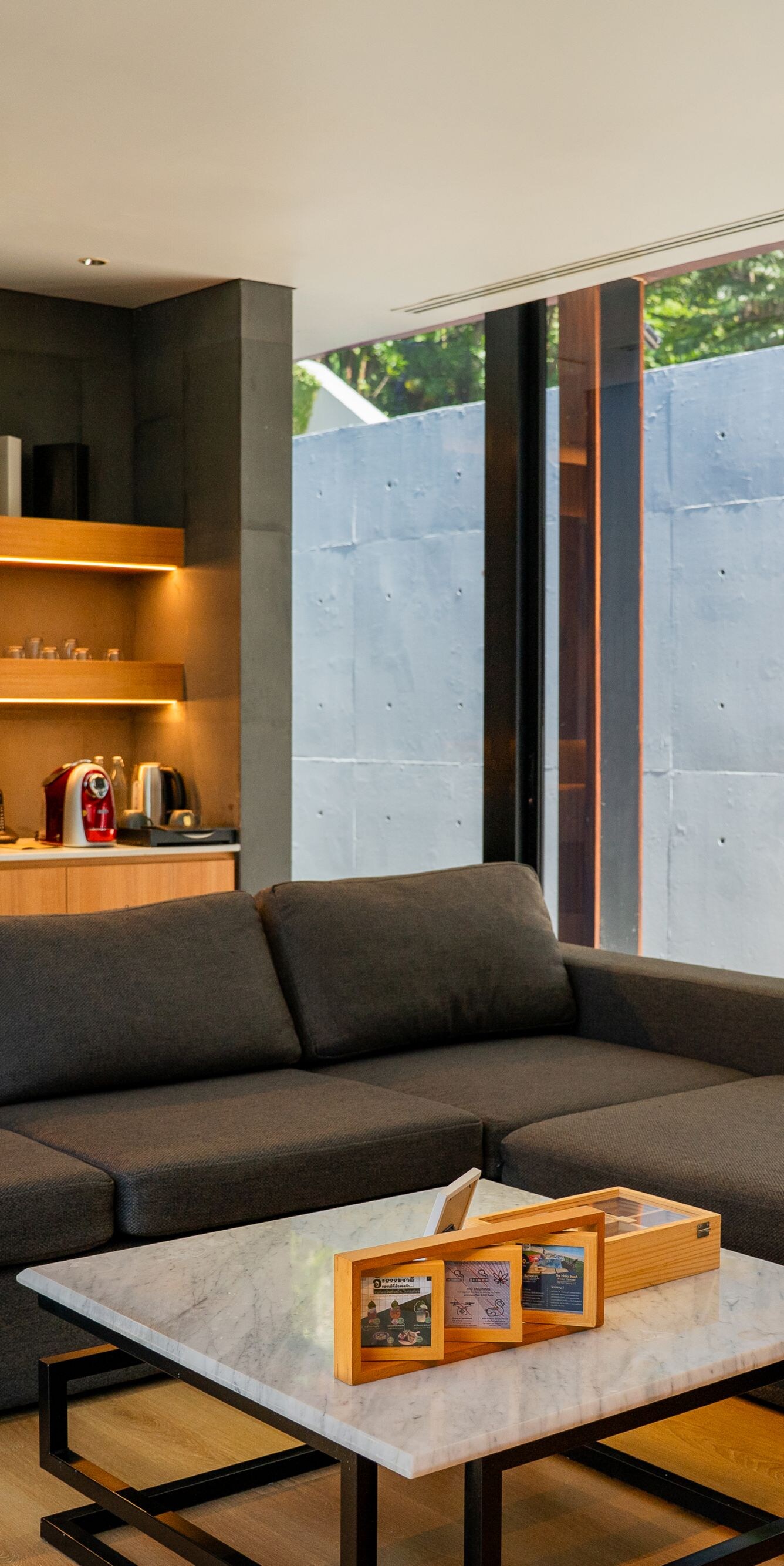 Gray sectional sofa with coffee table and wall lig
