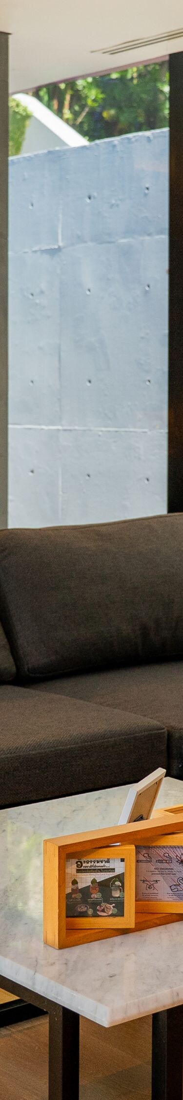 Gray sectional sofa with coffee table and wall lig