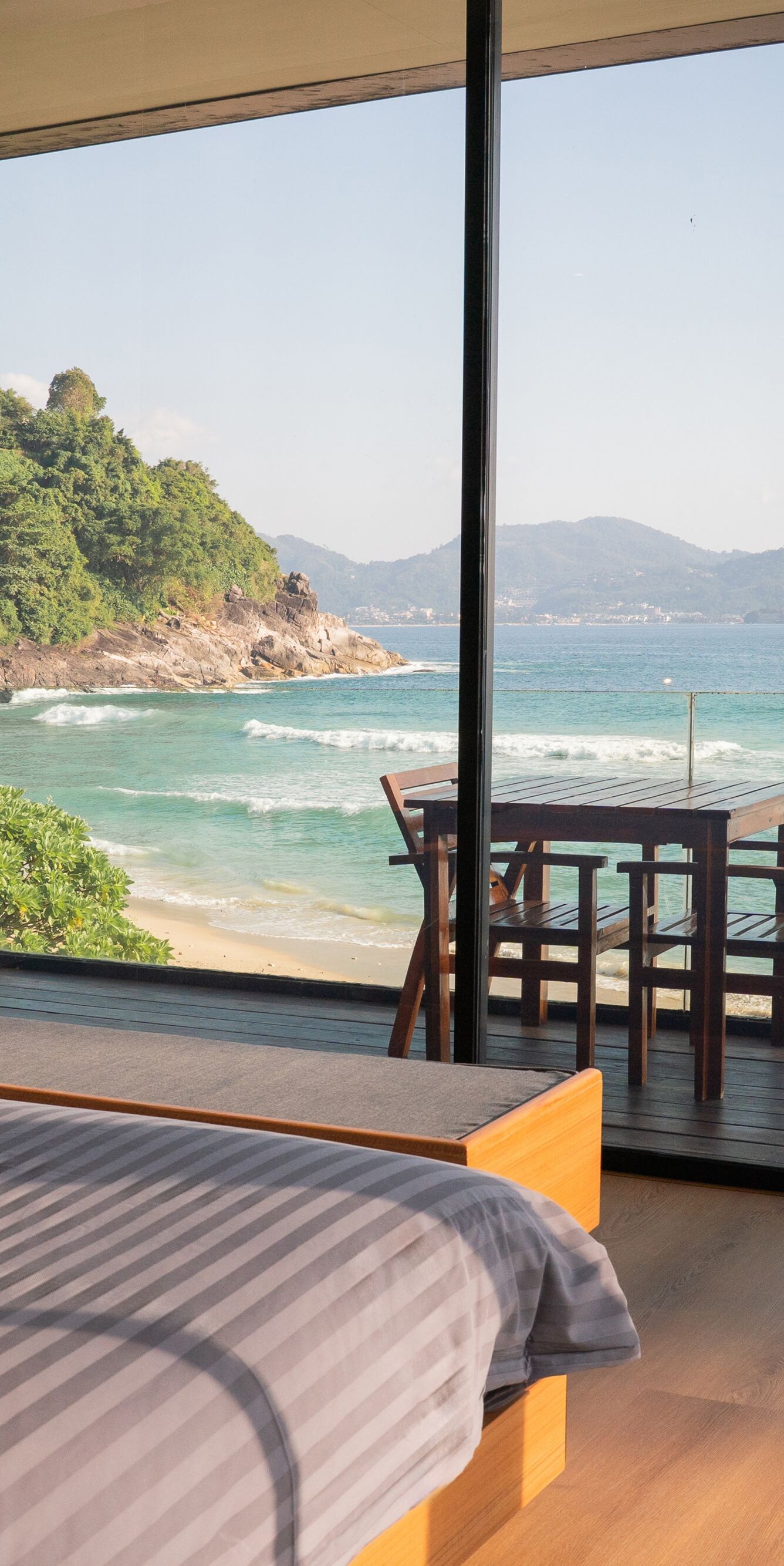 Bedroom with ocean view and outdoor dining table