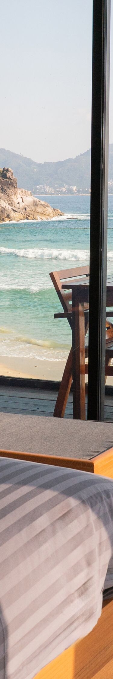 Bedroom with ocean view and outdoor dining table