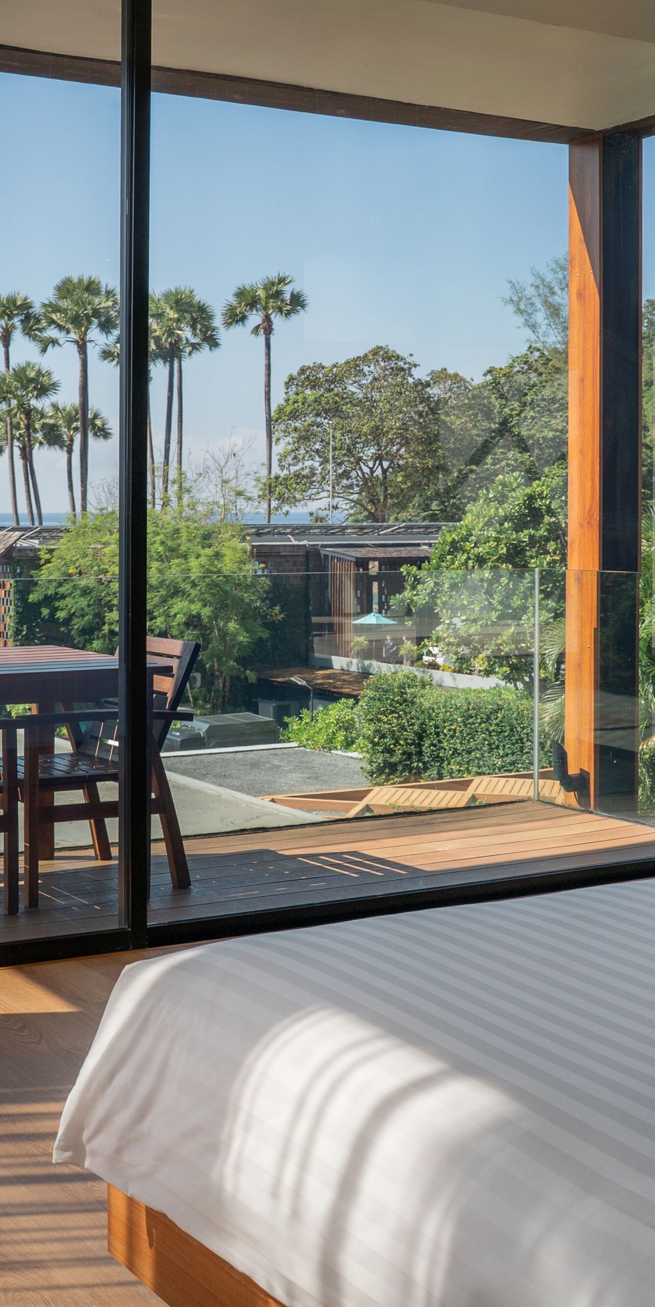 Bedroom with ocean view and outdoor dining table